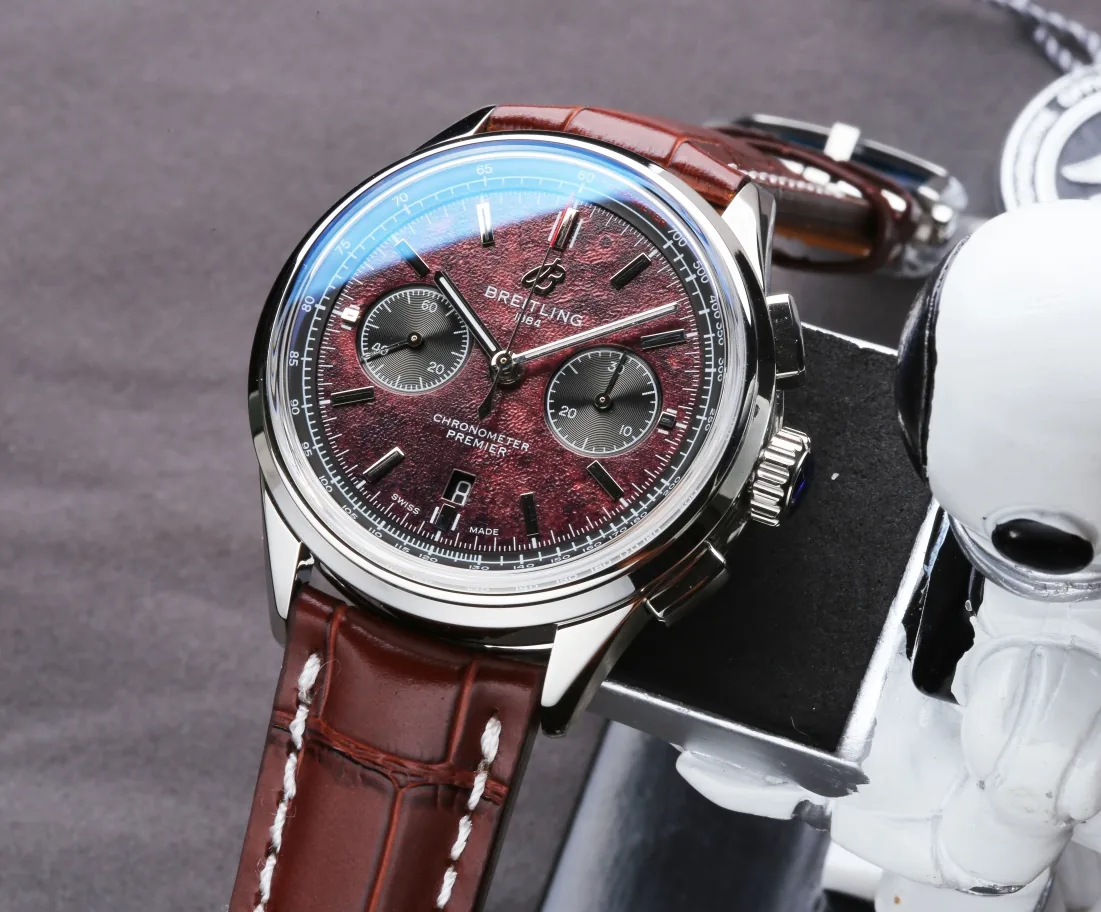 Swiss Elegant Replica Breitling Premier B01 AB01181A1Q1X2 42mm Watch – Red Dial, Brown Leather Strap