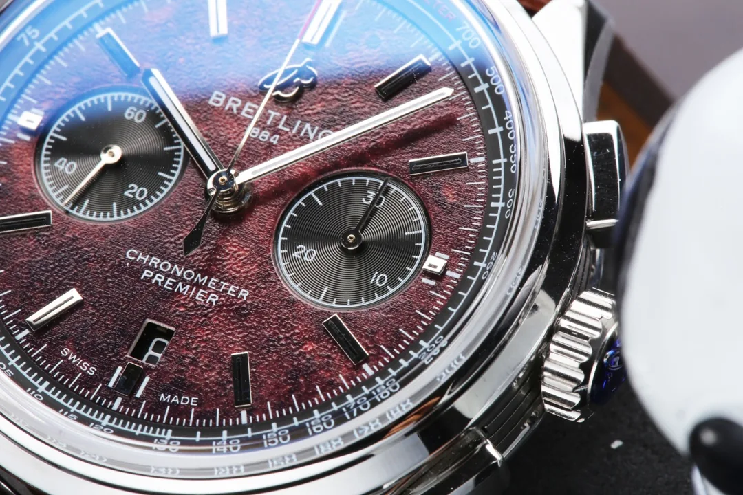 Swiss Elegant Replica Breitling Premier B01 AB01181A1Q1X2 42mm Watch – Red Dial, Brown Leather Strap