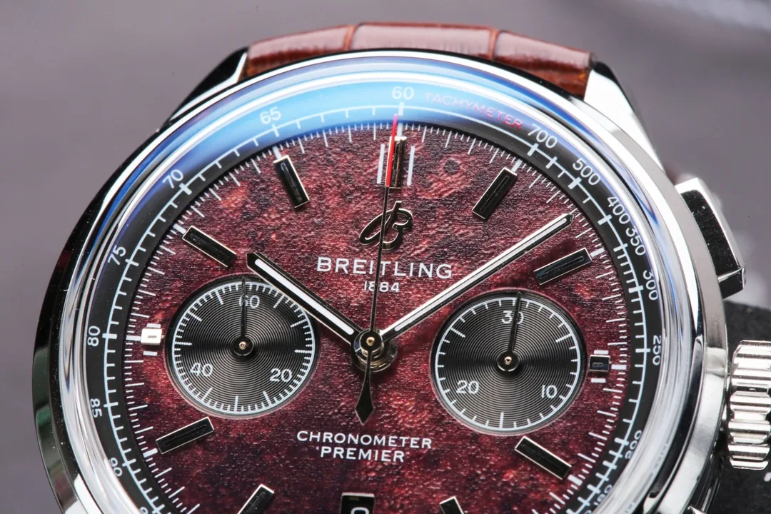 Swiss Elegant Replica Breitling Premier B01 AB01181A1Q1X2 42mm Watch – Red Dial, Brown Leather Strap
